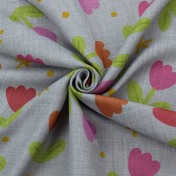 Muted greyish-blue fabric with a whimsical pattern of colourful tulips and small gold accents.