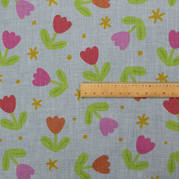 Muted greyish-blue fabric with a whimsical pattern of colourful tulips and small gold accents.