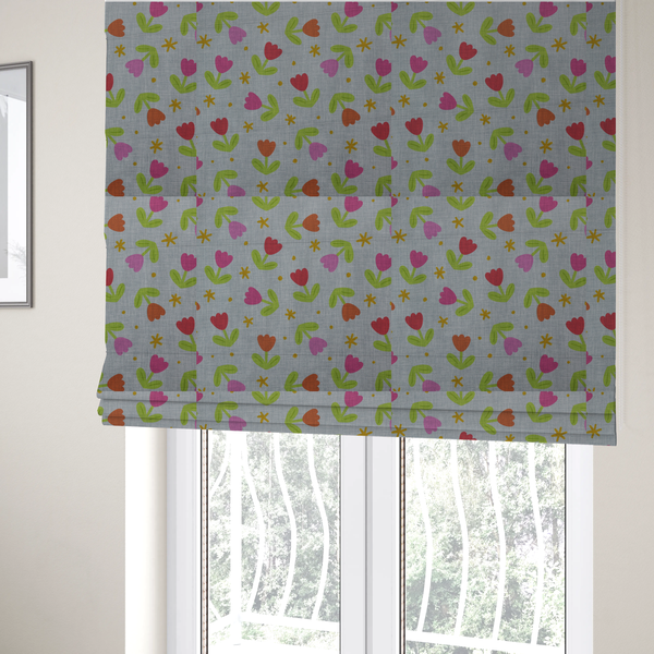 The fabric used to create these Roman blinds is a muted greyish-blue fabric with a whimsical pattern of colourful tulips and small gold accents.