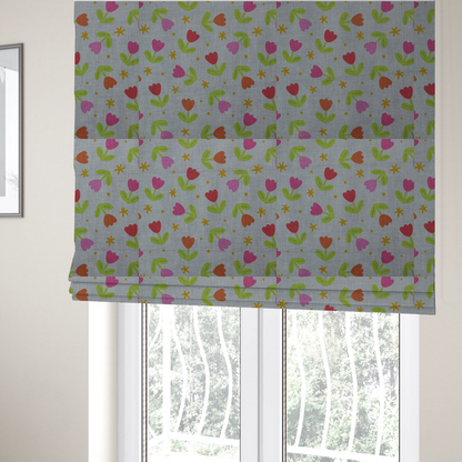 The fabric used to create these Roman blinds is a muted greyish-blue fabric with a whimsical pattern of colourful tulips and small gold accents.
