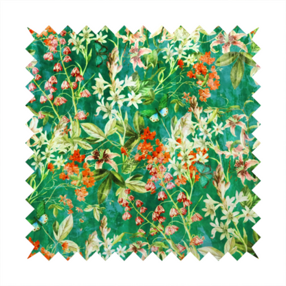 A dense, layered display of vibrant orange blossoms, delicate white jasmine-like star flowers, pink lily variations, and hanging bell-shaped blooms nestled among rich green foliage.