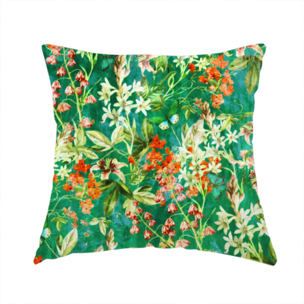The fabric used to create this handmade cushion is a dense, layered display of vibrant orange blossoms, delicate white jasmine-like star flowers, pink lily variations, and hanging bell-shaped blooms nestled among rich green foliage.
