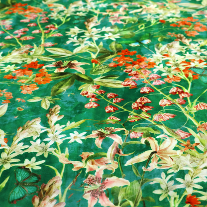 A dense, layered display of vibrant orange blossoms, delicate white jasmine-like star flowers, pink lily variations, and hanging bell-shaped blooms nestled among rich green foliage.