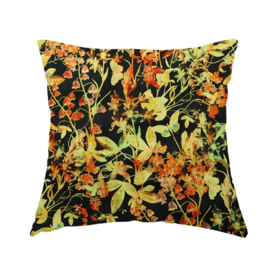 The fabric used to create this handmade cushion is a black fabric with an all-over botanical print of golden-yellow leaves, orange flowers, and subtle small butterflies.