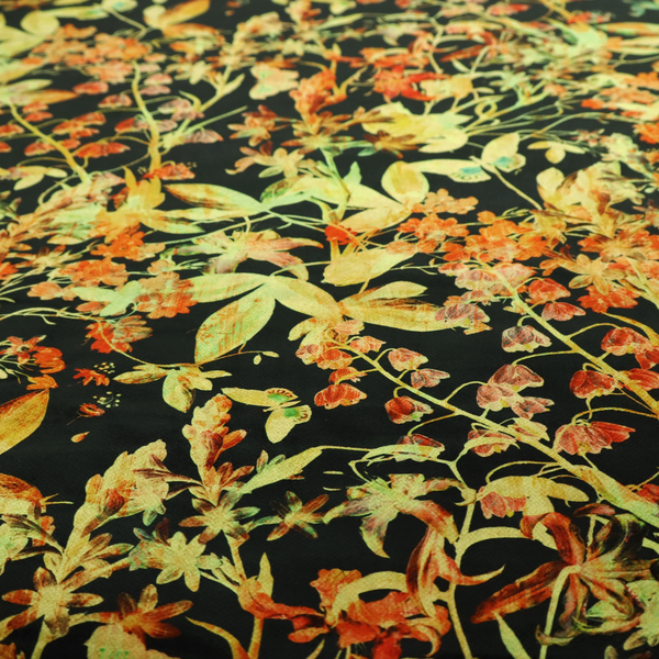 A black fabric with an all-over botanical print of golden-yellow leaves, orange flowers, and subtle small butterflies.