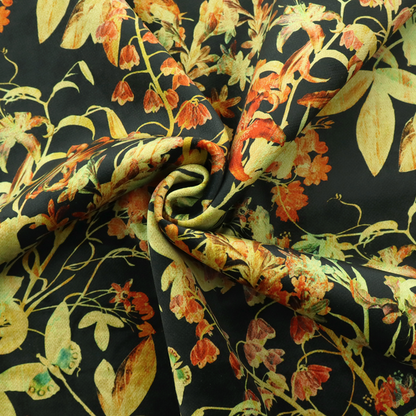 A black fabric with an all-over botanical print of golden-yellow leaves, orange flowers, and subtle small butterflies.