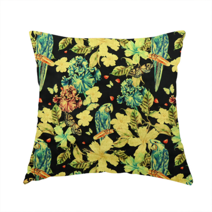 The fabric used to create this handmade cushion is a repeating fabric pattern featuring blue and green parrots, butterflies, and large tropical flowers on a black background.