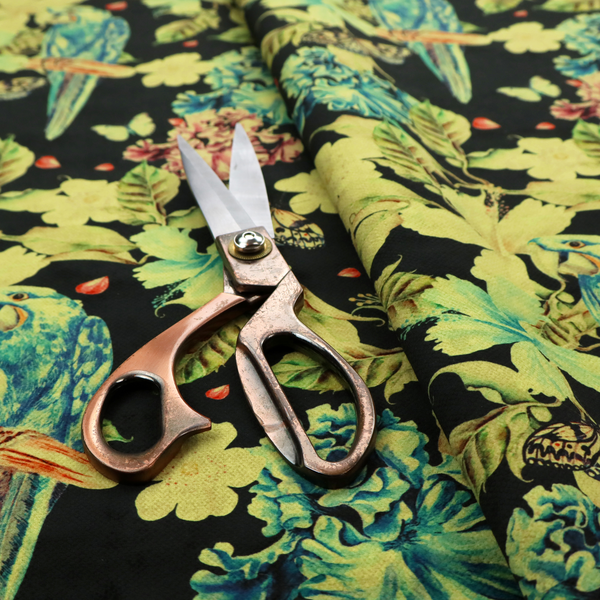 A repeating fabric pattern featuring blue and green parrots, butterflies, and large tropical flowers on a black background.