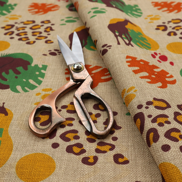 A repeating fabric pattern featuring giraffes, elephants, monstera leaves, and leopard prints on a natural beige linen background.