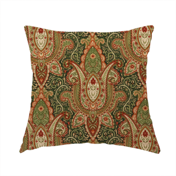 The fabric used to create this handmade cushion is a repeating ornate paisley and damask medallion fabric pattern in terracotta, sage green, and cream on a forest green background.