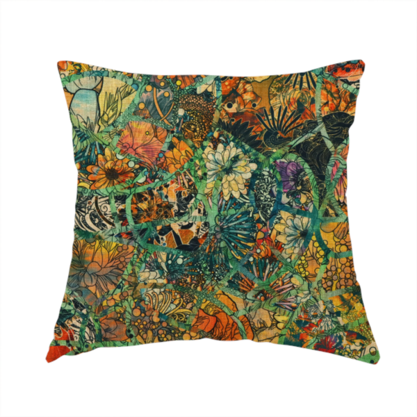The fabric used to create this handmade cushion is an abstract mosaic fabric pattern with stained glass-style botanical and floral illustrations in emerald green, orange, and gold tones.