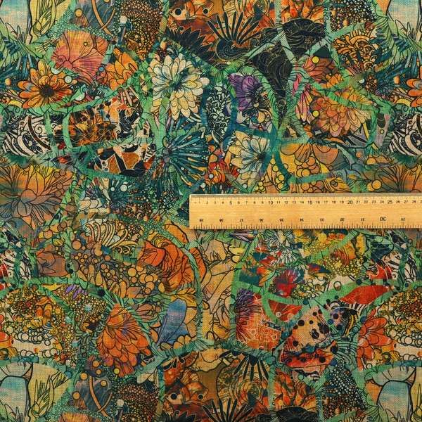 An abstract mosaic fabric pattern with stained glass-style botanical and floral illustrations in emerald green, orange, and gold tones.