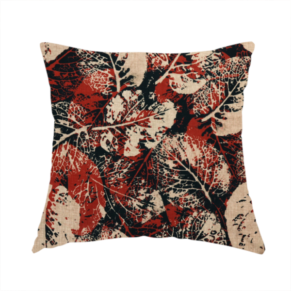 The fabric used to create this handmade cushion is an abstract skeleton leaf fabric pattern featuring bold botanical leaf motifs in terracotta red, natural beige, and black.