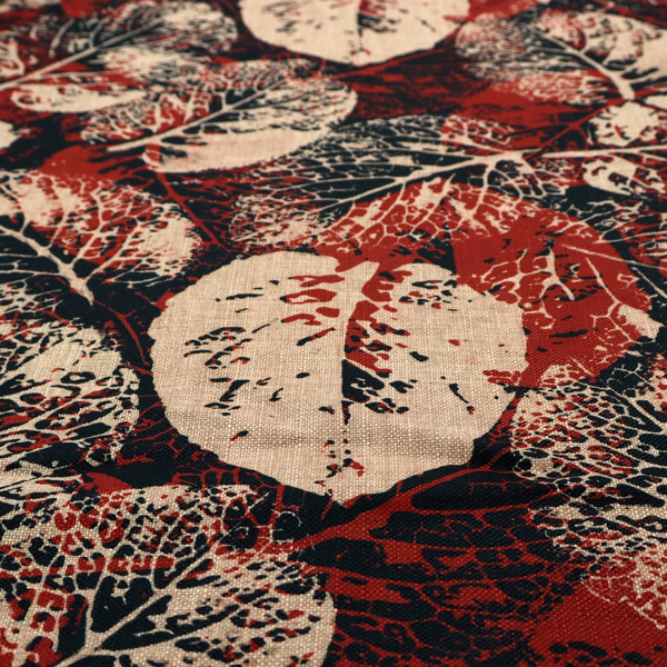 An abstract skeleton leaf fabric pattern featuring bold botanical leaf motifs in terracotta red, natural beige, and black.