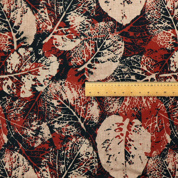 An abstract skeleton leaf fabric pattern featuring bold botanical leaf motifs in terracotta red, natural beige, and black.