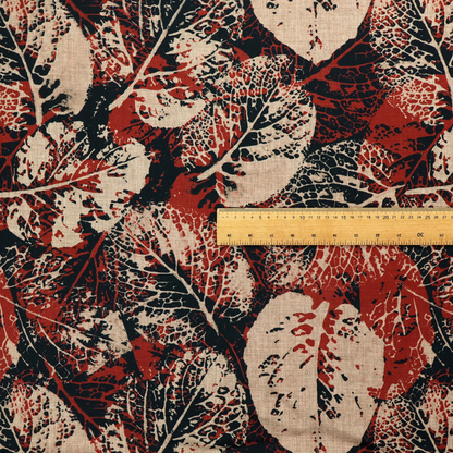An abstract skeleton leaf fabric pattern featuring bold botanical leaf motifs in terracotta red, natural beige, and black.