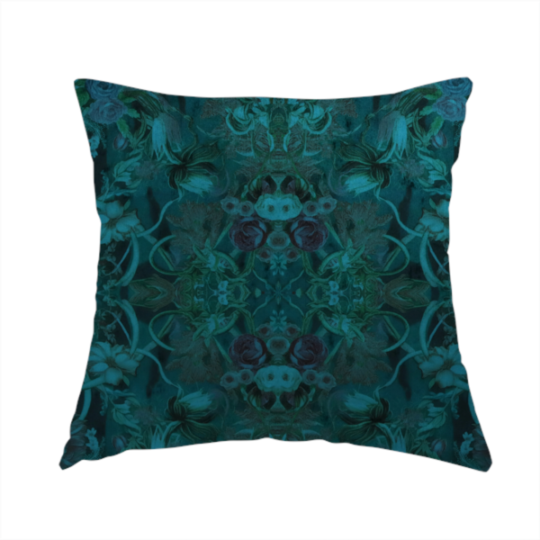 The fabric used to create this handmade cushion is a symmetrical, damask-style botanical fabric pattern in deep teal and turquoise tones, featuring an intricate mirror-image design of large sunflowers, roses, swirling vines, and leafy foliage against a dark, textured background.