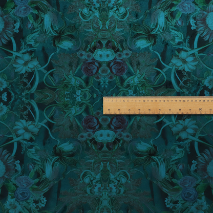 A symmetrical, damask-style botanical fabric pattern in deep teal and turquoise tones, featuring an intricate mirror-image design of large sunflowers, roses, swirling vines, and leafy foliage against a dark, textured background.