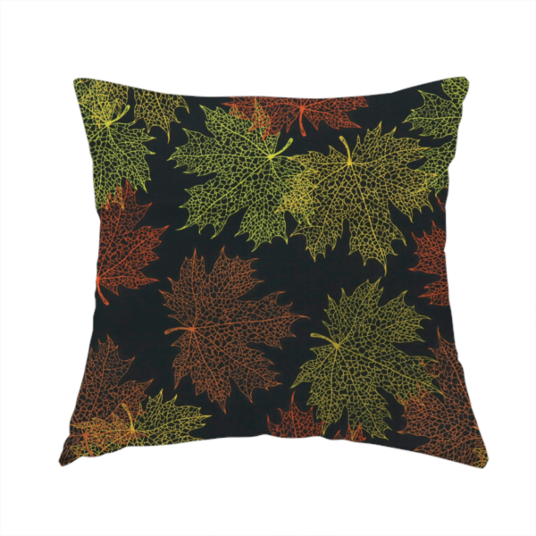 The fabric used to create this handmade cushion is an autumn botanical fabric pattern featuring detailed skeleton maple leaf outlines in rust red, olive green, and gold on a black background.