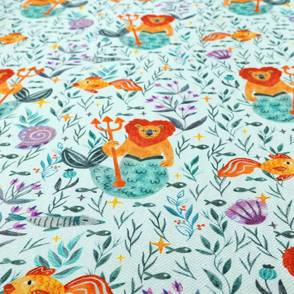 A whimsical fabric pattern featuring orange lion mermaids holding tridents surrounded by fish, sea shells, and ocean flora on a light aqua background.