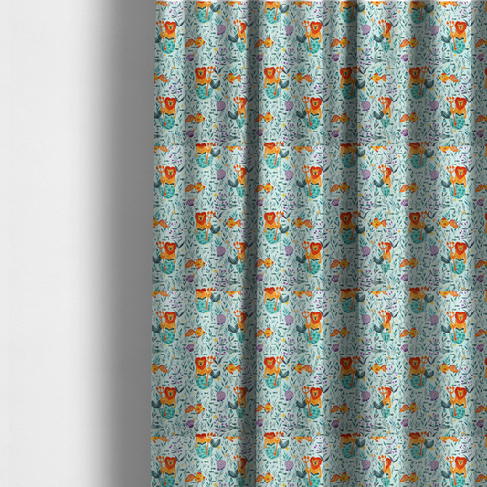 The fabric used to create these made-to-measure curtains is a whimsical fabric pattern featuring orange lion mermaids holding tridents surrounded by fish, sea shells, and ocean flora on a light aqua background.
