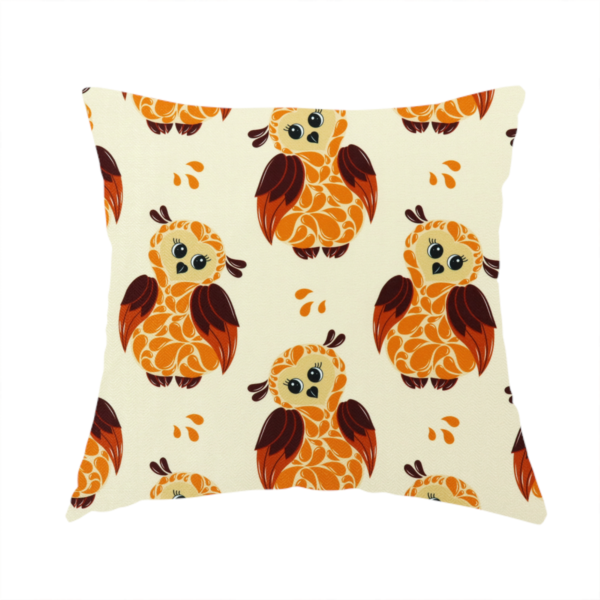 The fabric used to create this handmade cushion is a repeating fabric pattern featuring illustrated owls with paisley-patterned bodies in warm orange, brown, and ochre on a cream background.