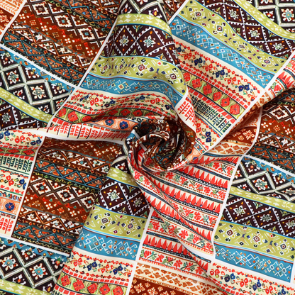 Vibrant multi-coloured tribal patchwork fabric featuring geometric and Aztec folk patterns.