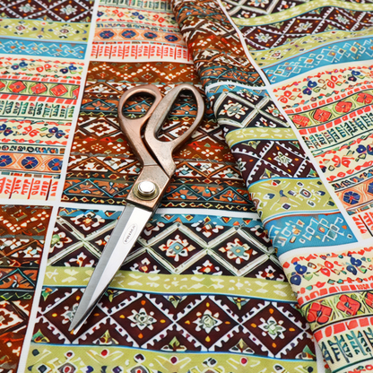 Vibrant multi-coloured tribal patchwork fabric featuring geometric and Aztec folk patterns.