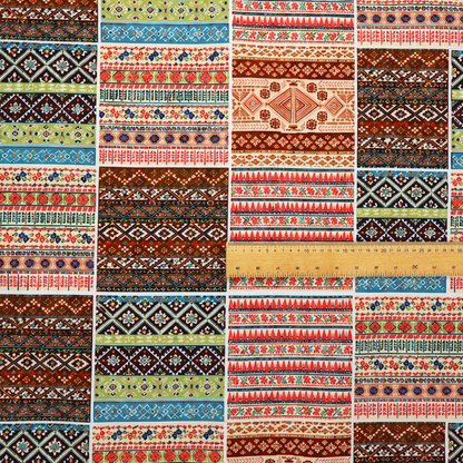 Vibrant multi-coloured tribal patchwork fabric featuring geometric and Aztec folk patterns.