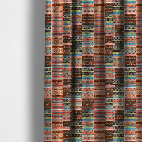 The fabric used to create these made-to-measure curtains is a vibrant multi-coloured tribal patchwork fabric featuring geometric and Aztec folk patterns.
