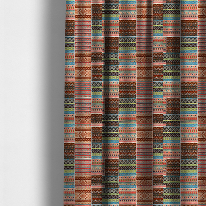 The fabric used to create these made-to-measure curtains is a vibrant multi-coloured tribal patchwork fabric featuring geometric and Aztec folk patterns.