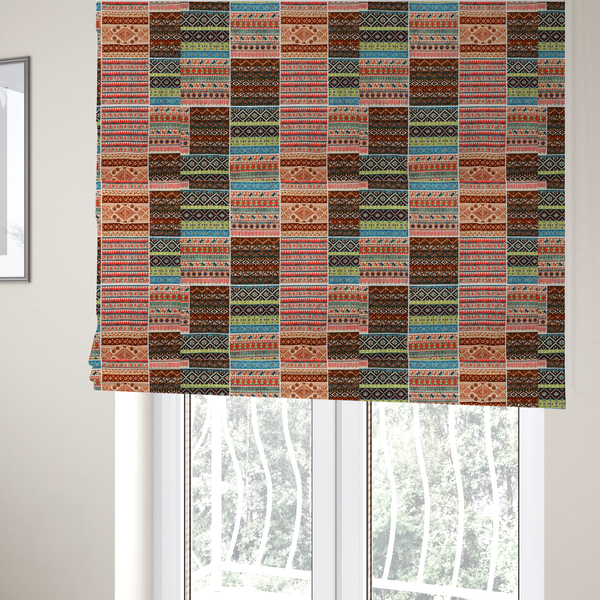 The fabric used to create these Roman blinds is a vibrant multi-coloured tribal patchwork fabric featuring geometric and Aztec folk patterns.