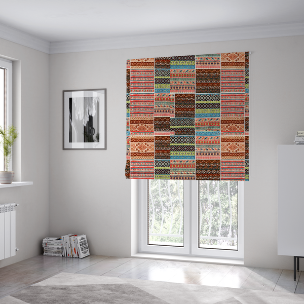 The fabric used to create these Roman blinds is a vibrant multi-coloured tribal patchwork fabric featuring geometric and Aztec folk patterns.