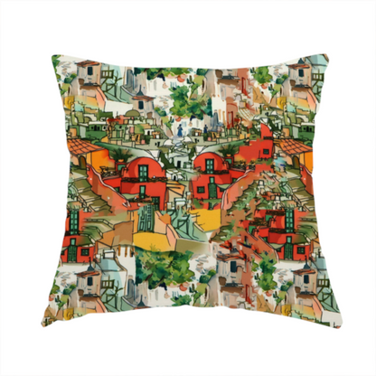 The fabric used to create this handmade cushion is an illustrated fabric pattern featuring a Mediterranean hillside village with terracotta houses, green foliage, and ochre accents