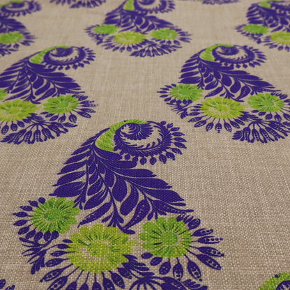 A repeating floral paisley pattern featuring vibrant indigo blue and lime green motifs set against a textured natural beige linen-effect background.