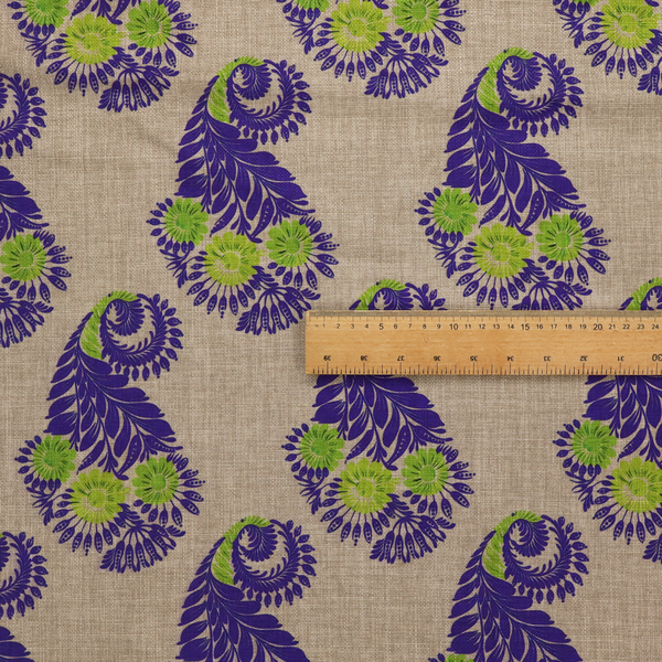 A repeating floral paisley pattern featuring vibrant indigo blue and lime green motifs set against a textured natural beige linen-effect background.
