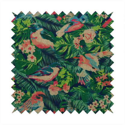 Tropical print fabric featuring colourful birds, palm leaves, and pink flowers against a dark background.