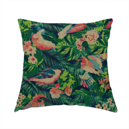 The fabric used to create this handmade cushion is a tropical print fabric featuring colourful birds, palm leaves, and pink flowers against a dark background.