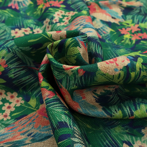 Tropical print fabric featuring colourful birds, palm leaves, and pink flowers against a dark background.