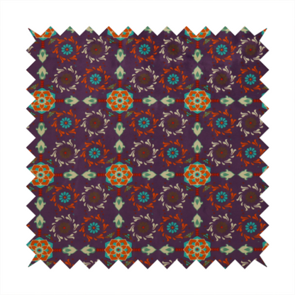 Geometric pattern fabric featuring a purple background with repeating orange and teal mandala-style floral motifs.