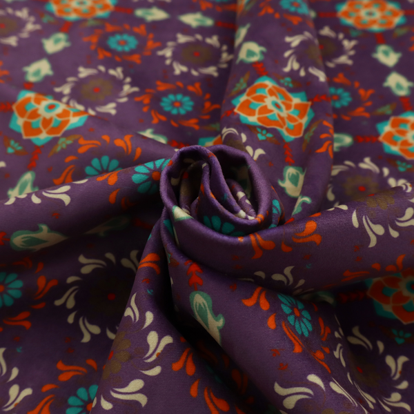 Geometric pattern fabric featuring a purple background with repeating orange and teal mandala-style floral motifs.