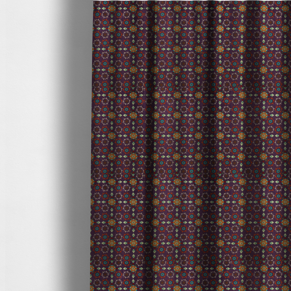 The fabric used to create these made-to-measure curtains is a geometric pattern fabric featuring a purple background with repeating orange and teal mandala-style floral motifs.
