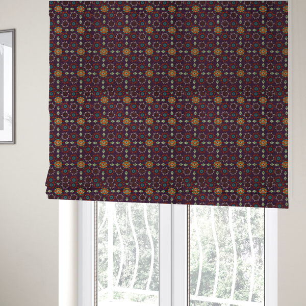 The fabric used to create these roman blinds is a geometric pattern fabric featuring a purple background with repeating orange and teal mandala-style floral motifs.