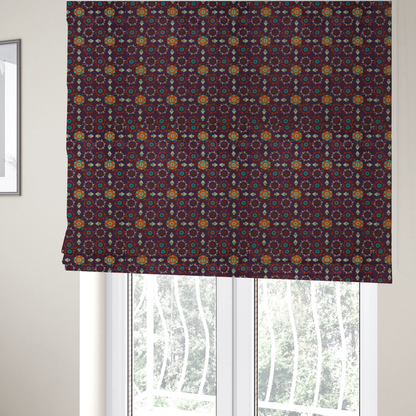 The fabric used to create these roman blinds is a geometric pattern fabric featuring a purple background with repeating orange and teal mandala-style floral motifs.