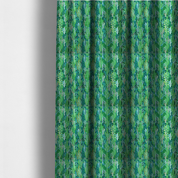 The fabric used to create these made-to-measure curtains is a vibrant, dense pattern of stylized painted saguaro cacti and succulents in shades of green, mint, and white with black polka dots and dashes over a turquoise background.