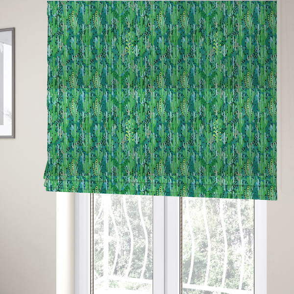The fabric used to create these Roman blinds is a vibrant, dense pattern of stylized painted saguaro cacti and succulents in shades of green, mint, and white with black polka dots and dashes over a turquoise background.