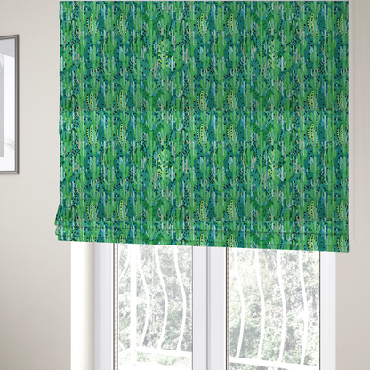 The fabric used to create these Roman blinds is a vibrant, dense pattern of stylized painted saguaro cacti and succulents in shades of green, mint, and white with black polka dots and dashes over a turquoise background.