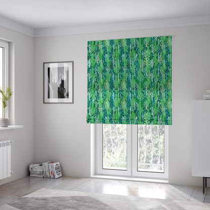 The fabric used to create these Roman blinds is a vibrant, dense pattern of stylized painted saguaro cacti and succulents in shades of green, mint, and white with black polka dots and dashes over a turquoise background.