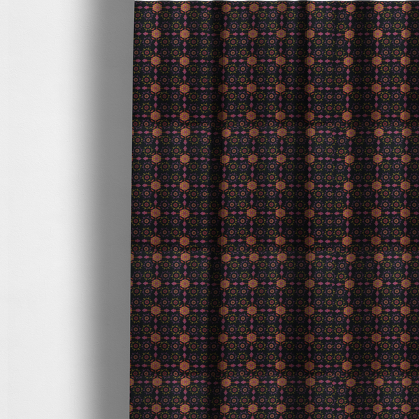 The fabric used to create these made-to-measure curtains is an  intricate geometric fabric pattern featuring repeating mandala motifs, floral medallions, and ornate tiles in shades of pink, orange, yellow, and purple set against a dark black background.