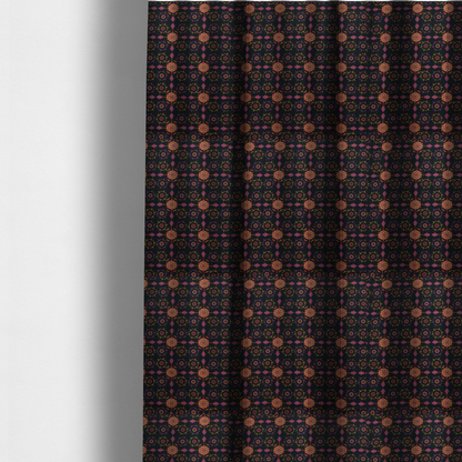 The fabric used to create these made-to-measure curtains is an  intricate geometric fabric pattern featuring repeating mandala motifs, floral medallions, and ornate tiles in shades of pink, orange, yellow, and purple set against a dark black background.